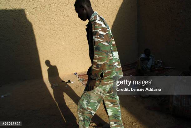 Sudanese government soldiers sit in a prison in Iriba, in northeastern Chad, October 14, 2006. Fierce fighting continues between Sudanese government...