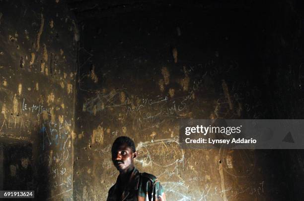 Sudanese government soldiers sit in a prison in Iriba, in northeastern Chad, October 14, 2006. Fierce fighting continues between Sudanese government...