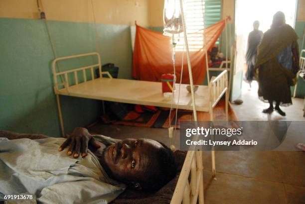 Ibrahim Hatoon a Sudanese government soldier from Khartoum, lies wounded in a local hospital in Iriba, in northeastern Chad, October 14, 2006. Fierce...