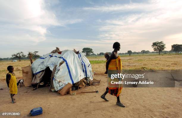 Villagers from Jameisi, Jadida, and other nearby recently attacked by Chadian Arabs, linger at dawn in a makeshift camp for internally displaced...