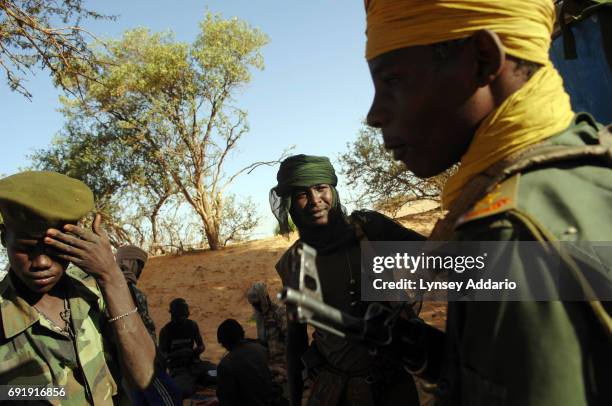 Sudanese rebels with the NRF hang out at dawn near Kariari, somewhere between Chad and the Darfur border, where dozens of rebels come to relax,...