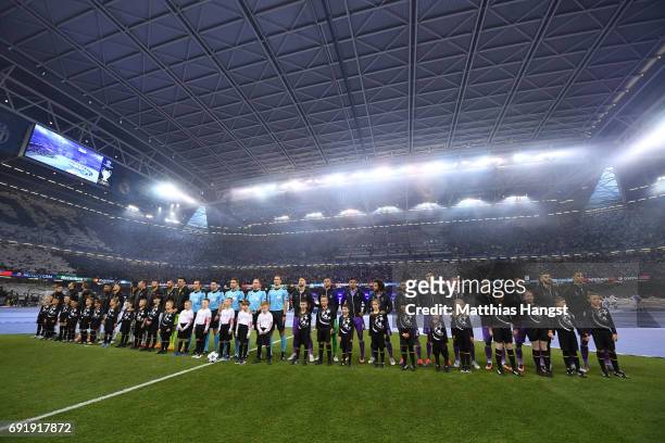 Juventus team and Real Madrid teams line up rior to the UEFA Champions League Final between Juventus and Real Madrid at National Stadium of Wales on...