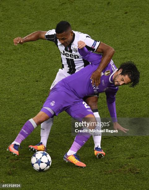 Alex Sandro of Juventus and Isco of Real Madrid battle for possession during the UEFA Champions League Final between Juventus and Real Madrid at...