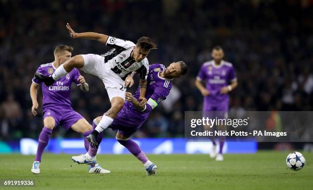 Juventus' Paulo Dybala and Real Madrid's Sergio Ramos battle for the ball during the UEFA Champions League Final at the National Stadium, Cardiff.