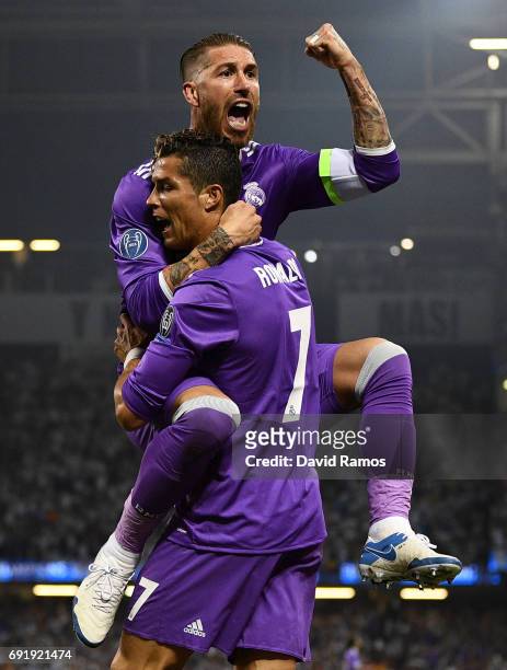 Cristiano Ronaldo of Real Madrid celebrates scoring his sides first goal with Sergio Ramos of Real Madrid during the UEFA Champions League Final...