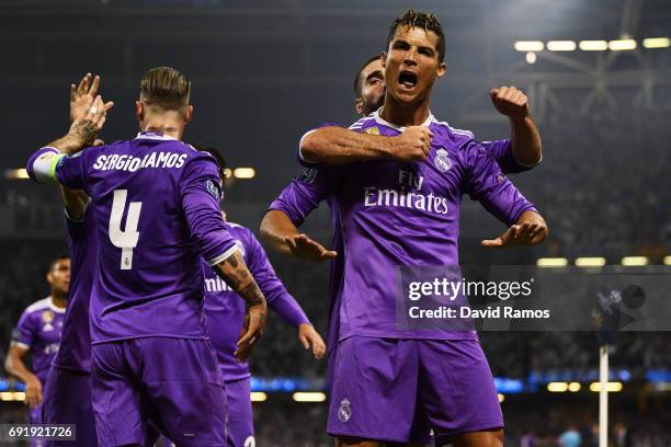 Cristiano Ronaldo of Real Madrid celebrates scoring his sides first goal with his Real Madrid team mates during the UEFA Champions League Final...