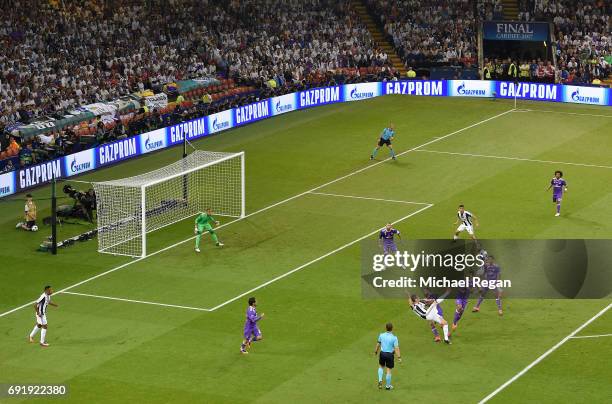 Mario Mandzukic of Juventus scores his sides first goal past Keylor Navas of Real Madrid during the UEFA Champions League Final between Juventus and...