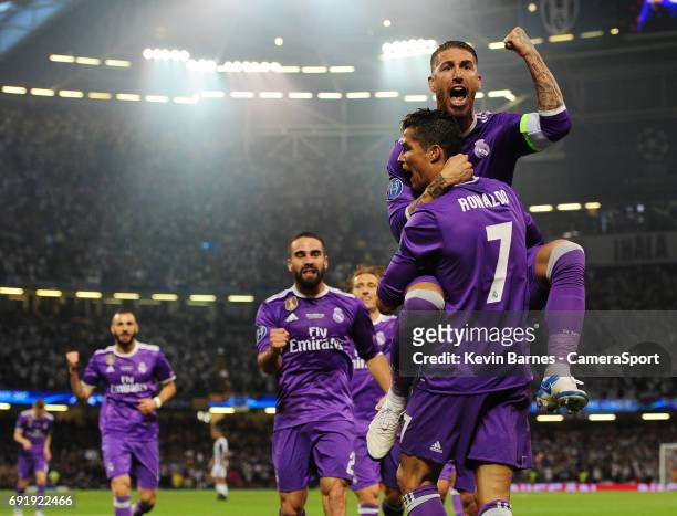 Cristiano Ronaldo of Real Madrid celebrates scoring his sides first goal with team-mate Sergio Ramos during the UEFA Champions League Final match...