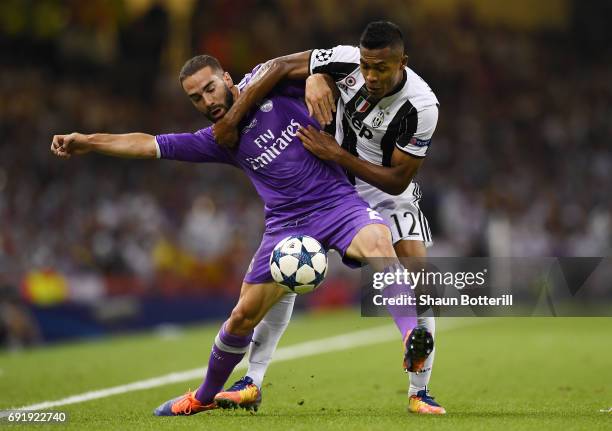 Daniel Carvajal of Real Madrid and Alex Sandro of Juventus battle for possession during the UEFA Champions League Final between Juventus and Real...