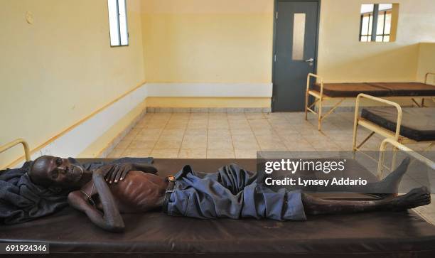 Man lies sick in the ward for Tuburculosis and HIV patients in the Juba Hospital, in South Sudan, February 8, 2008. Since the numbers of Sudanese...