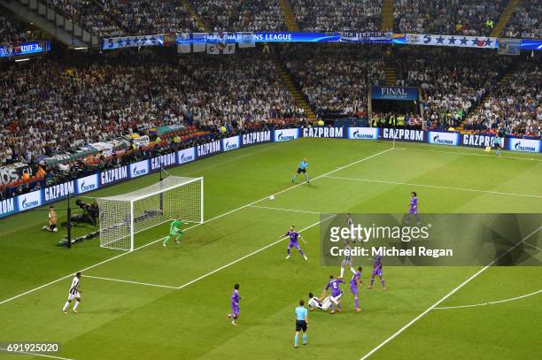 Mario Mandzukic of Juventus scores his sides first goal during the UEFA Champions League Final between Juventus and Real Madrid at National Stadium...