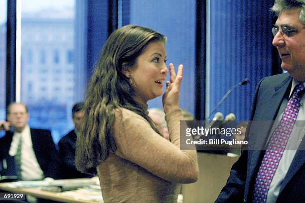 Actress Yasmine Bleeth wipes away tears while speaking with her attorney Jerome Sabbota following her sentencing in Wayne County Circuit Court...