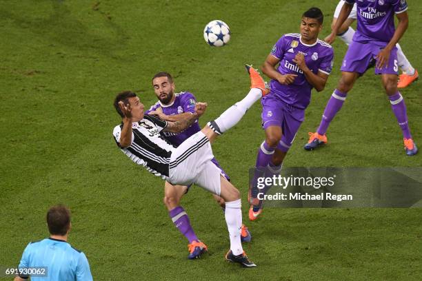 Mario Mandzukic of Juventus scores his sides first goal during the UEFA Champions League Final between Juventus and Real Madrid at National Stadium...