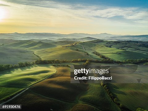 Tuscany landscape at sunrise with low fog Tuscany landscape at sunrise with low fog