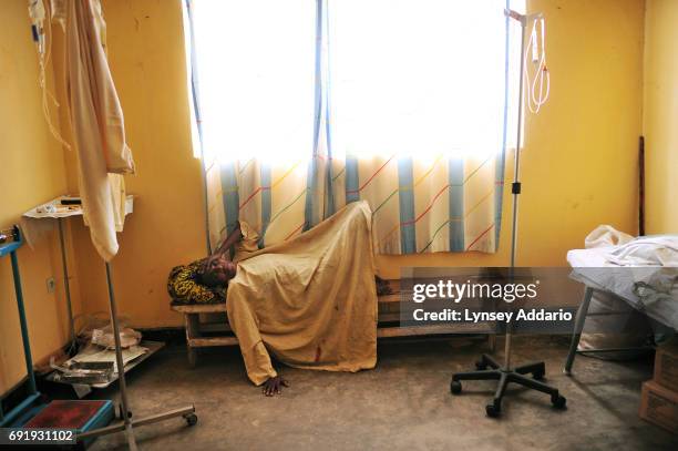 Keysuba lies in pain in the waiting room for surgery in the Keyshero medical center in Goma, North Kivu, in Eastern Congo, April 12, 2008. Keysuba...