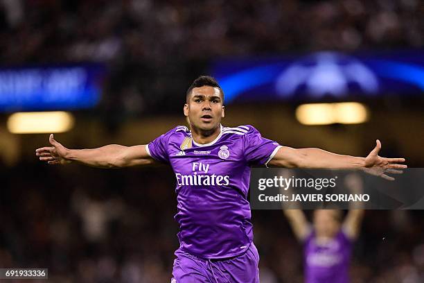 Real Madrid's Brazilian midfielder Casemiro celebrates after scoring their second goal during the UEFA Champions League final football match between...