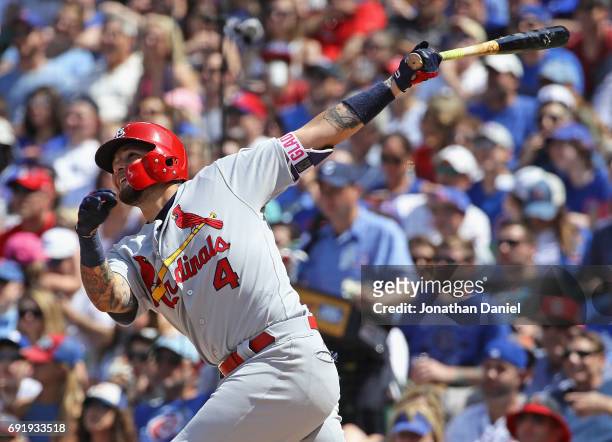 Yadier Molina of the St. Louis Cardinals hits a solo home run in the 6th inning against the Chicago Cubs at Wrigley Field on June 3, 2017 in Chicago,...