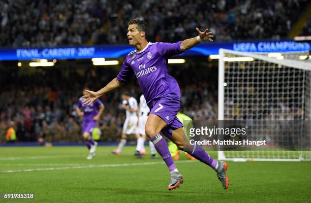 Cristiano Ronaldo of Real Madrid celebrates scoring his sides third goal during the UEFA Champions League Final between Juventus and Real Madrid at...