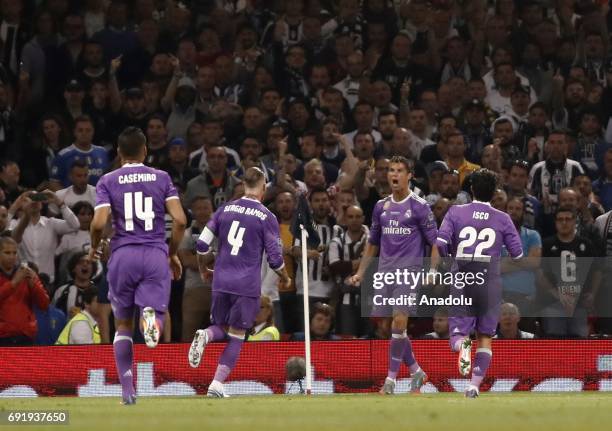 Cristiano Ronaldo of Real Madrid celebrates with his teammates after scoring during of UEFA Champions League Final soccer match between Juventus and...