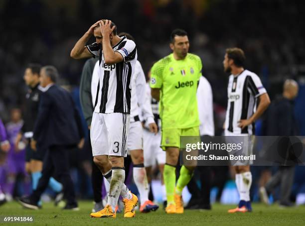 Giorgio Chiellini of Juventus is dejected after the UEFA Champions League Final between Juventus and Real Madrid at National Stadium of Wales on June...