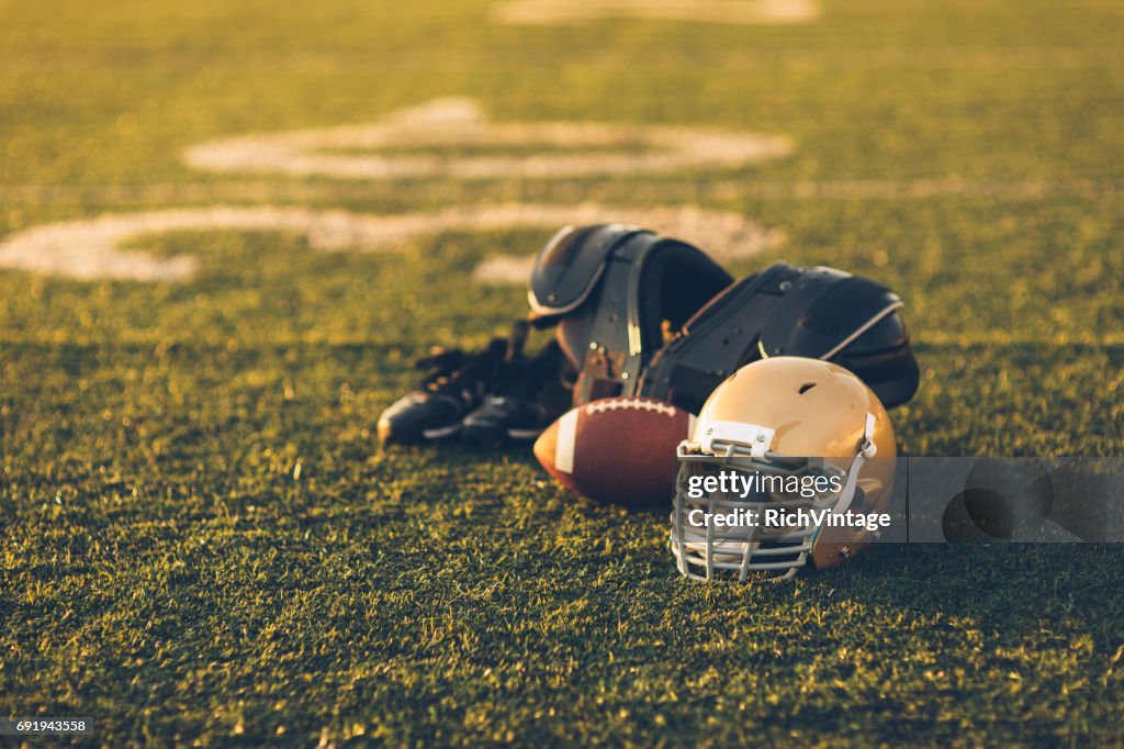 Gold Football Helmet on Field