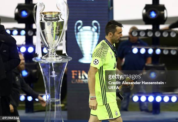 Gianluigi Buffon of Juventus collects his runners up medal after the UEFA Champions League Final between Juventus and Real Madrid at National Stadium...