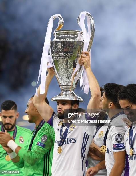 Daniel Carvajal of Real Madrid celebrates with The Champions League trophy after the UEFA Champions League Final between Juventus and Real Madrid at...