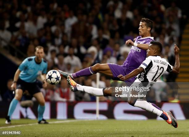 Cristiano Ronaldo of Real Madrid in action against Alex Sandro of Juventus during UEFA Champions League Final soccer match between Juventus and Real...