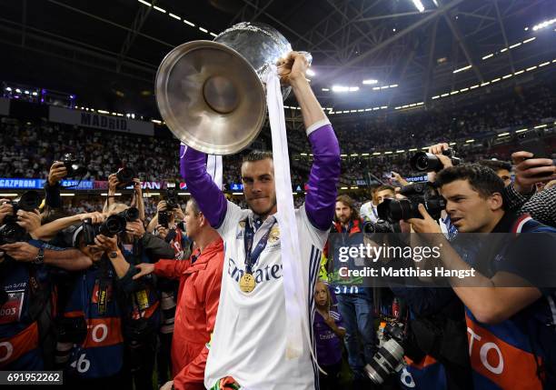 Gareth Bale of Real Madrid celebrates with The Champions League trophy after the UEFA Champions League Final between Juventus and Real Madrid at...