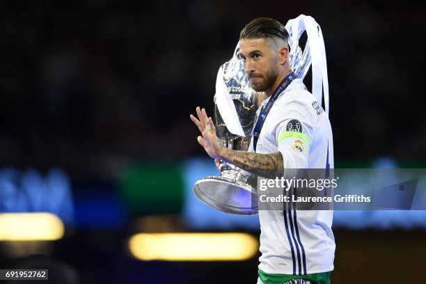 Sergio Ramos of Real Madrid celebrates with The Champions League trophy after the UEFA Champions League Final between Juventus and Real Madrid at...