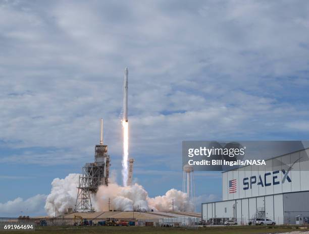 In this handout provided by the National Aeronautics and Space Administration , the SpaceX Falcon 9 rocket, with the Dragon spacecraft onboard,...