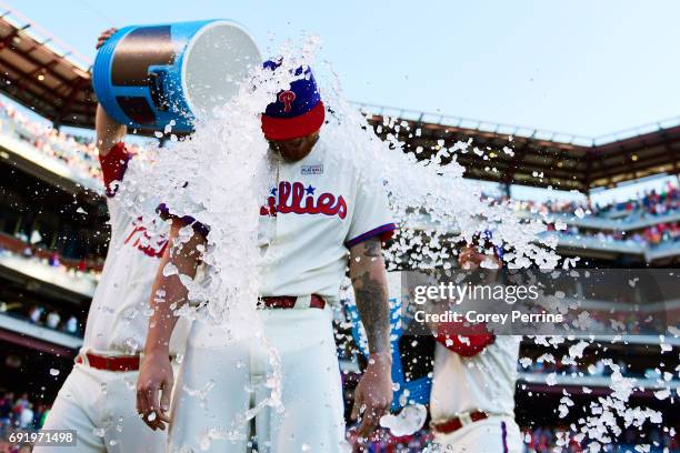 Ben Lively is doused after the game by Tommy Joseph and Cameron Rupp of the Philadelphia Phillies for his performance against the San Francisco...