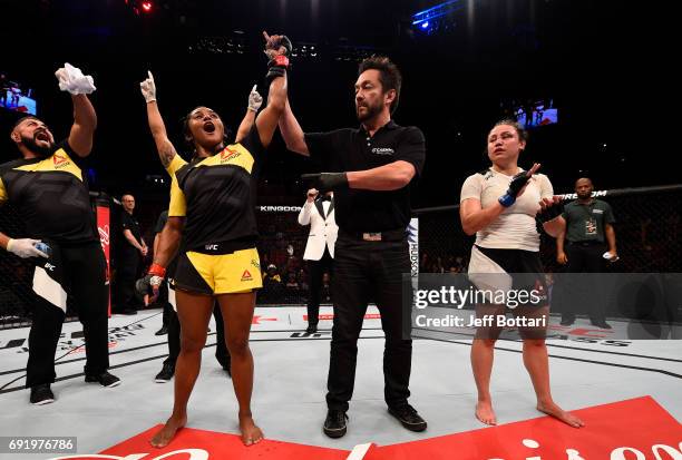 Viviane Pereira of Brazil celebrates after her unanimous-decision victory over Jamie Moyle in their womens strawweight bout during the UFC 212 event...