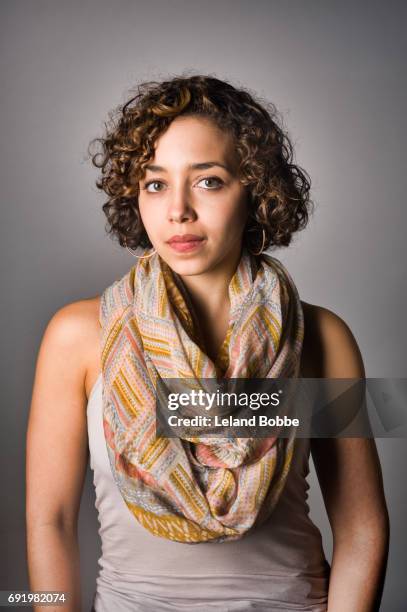 portrait of young mixed race woman - stern gold stock pictures, royalty-free photos & images