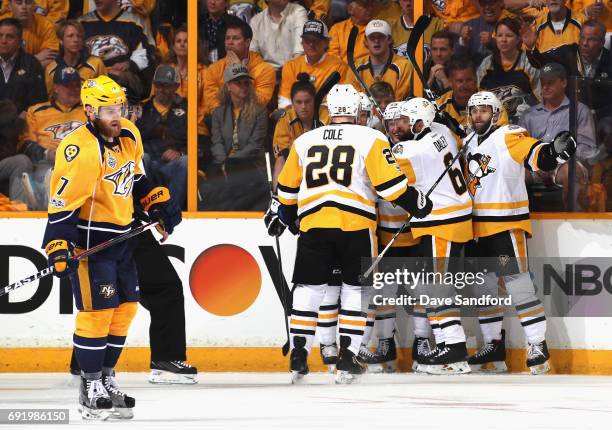 Jake Guentzel of the Pittsburgh Penguins celebrates his goal with teammates during the first period of Game Three of the 2017 NHL Stanley Cup Final...