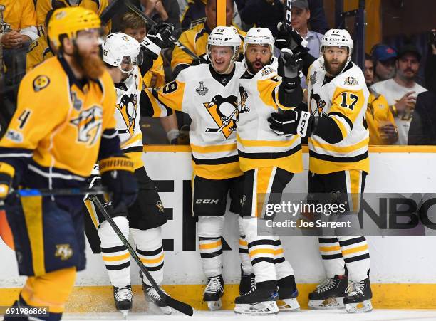 Jake Guentzel of the Pittsburgh Penguins celebrates his goal with teammates during the first period of Game Three of the 2017 NHL Stanley Cup Final...