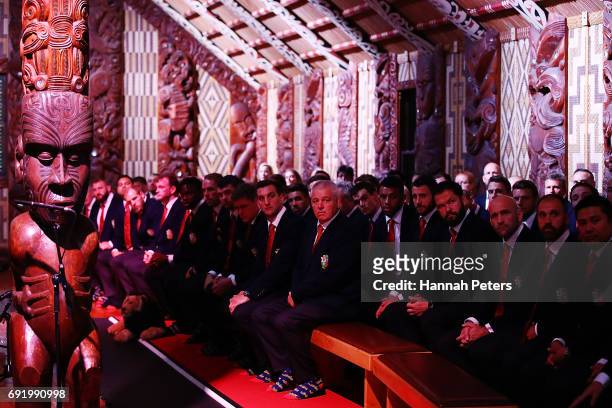 Head coach Warren Gatland the team listen to speeches inside the meeting house during the British & Irish Lions Maori Welcome at Waitangi Treaty...