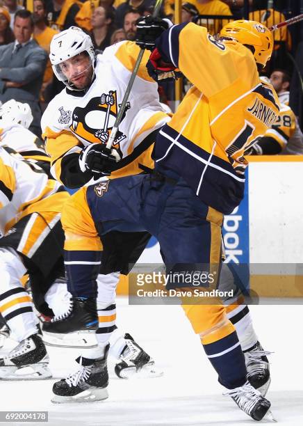 Matt Cullen of the Pittsburgh Penguins collides with Calle Jarnkrok of the Nashville Predators during the first period of Game Three of the 2017 NHL...