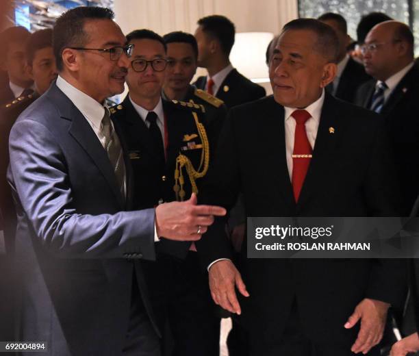 Malaysian Defence Minister Hishammuddin Tun Hussein and Indonesian Defense Minister General Ryamizard Ryacudu after attending a meeting between US...