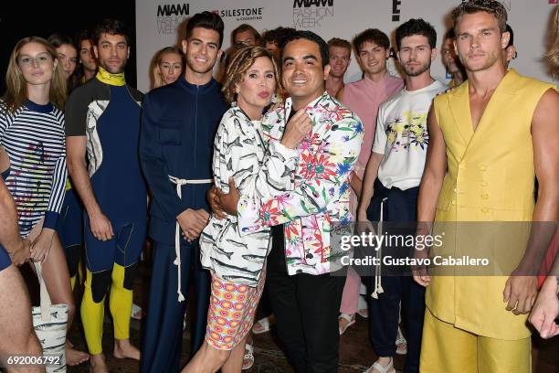 Designers Agatha Ruiz De La Prada and Yirko Sivirich pose backstage at the Yirko Sivirich Show during Miami Fashion Week at Ice Palace Film Studios...