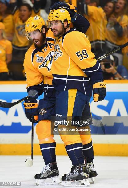 Roman Josi of the Nashville Predators celebrates his goal with teammate James Neal during the second period of Game Three of the 2017 NHL Stanley Cup...