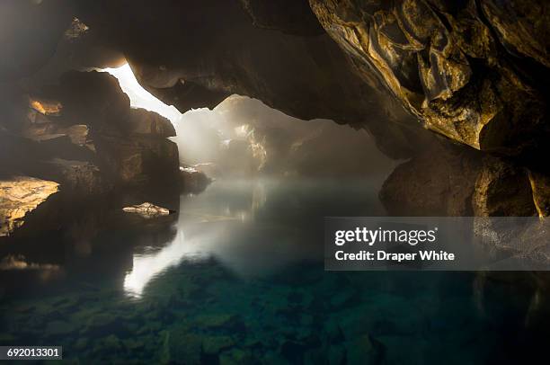 hot springs in a cave in iceland - grot stockfoto's en -beelden