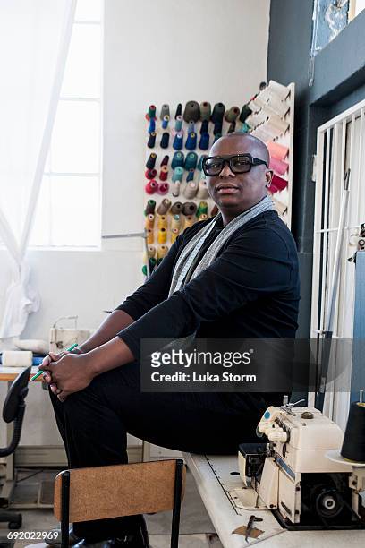 portrait of man in workshop looking at camera - personal tailor stock pictures, royalty-free photos & images