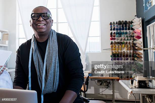 portrait of male fashion designer in design studio - african male portrait fotografías e imágenes de stock