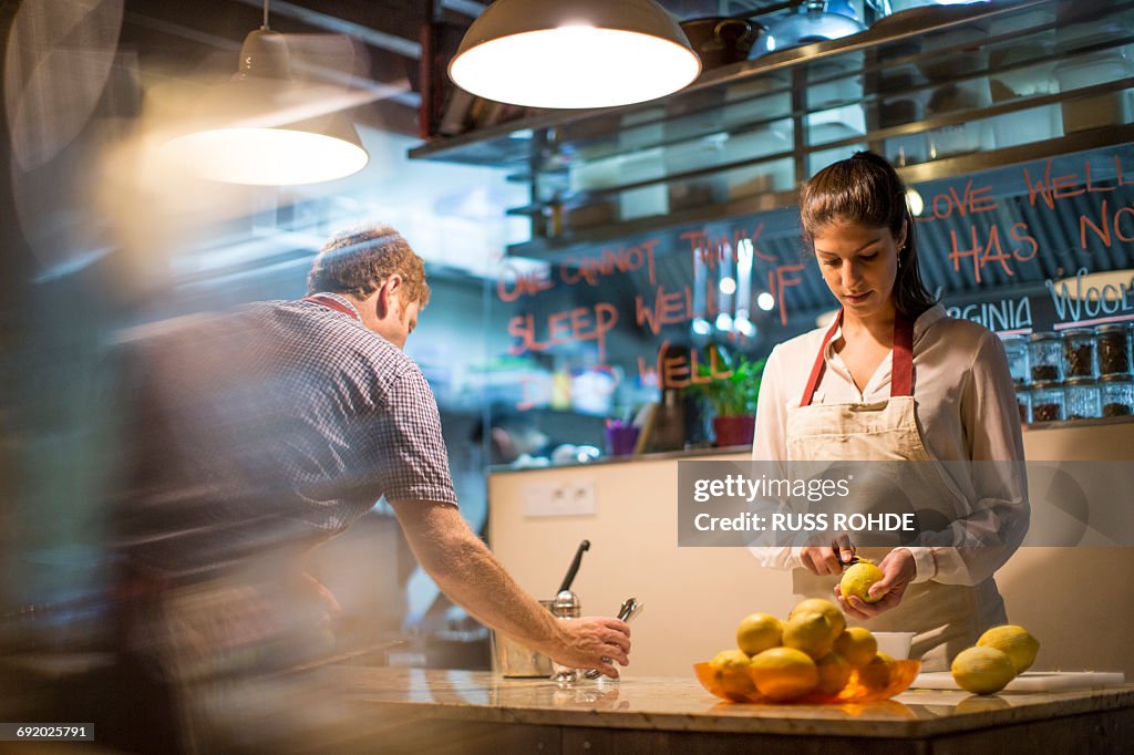 Restaurant owners working in kitchen