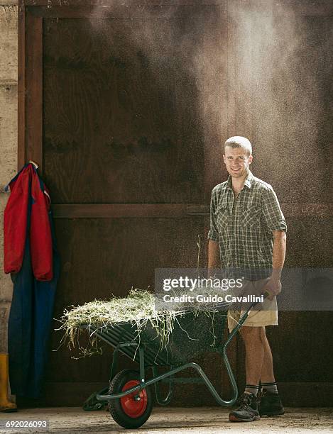 Rustic Workers 284 Wheelbarrow Rustic Stock Photos, High-Res Pictures, and Images ...