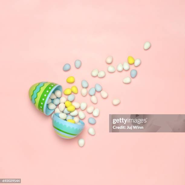 easter candy spilling from plastic egg - chocolate square stock pictures, royalty-free photos & images