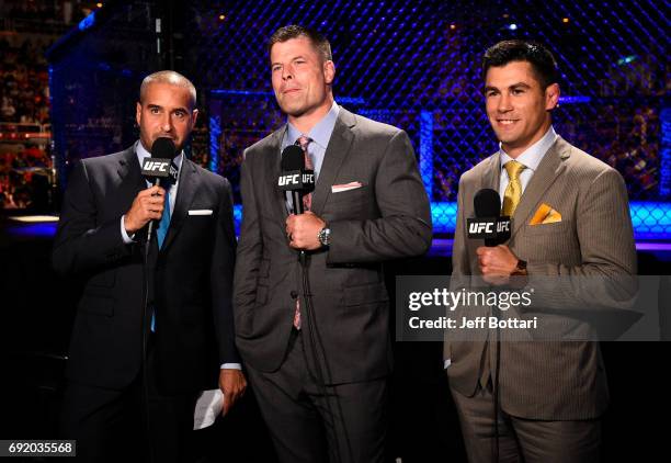 Commentators Jon Anik, Brian Stann, and Dominick Cruz anchor the broadcast during the UFC 212 event at Jeunesse Arena on June 3, 2017 in Rio de...