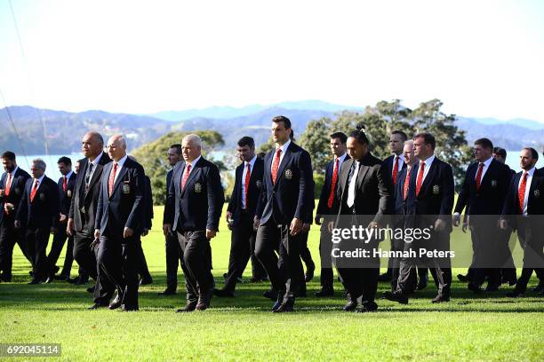 Lions team manager John Spencer, head coach Warren Gatland of the Lions and Sam Warburton of the Lions lead the team to the meeting house during the...