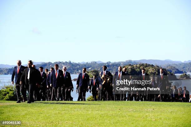 The Lions team walk up to the meeting house during the British & Irish Lions Maori Welcome at Waitangi Treaty Grounds on June 4, 2017 in Waitangi,...